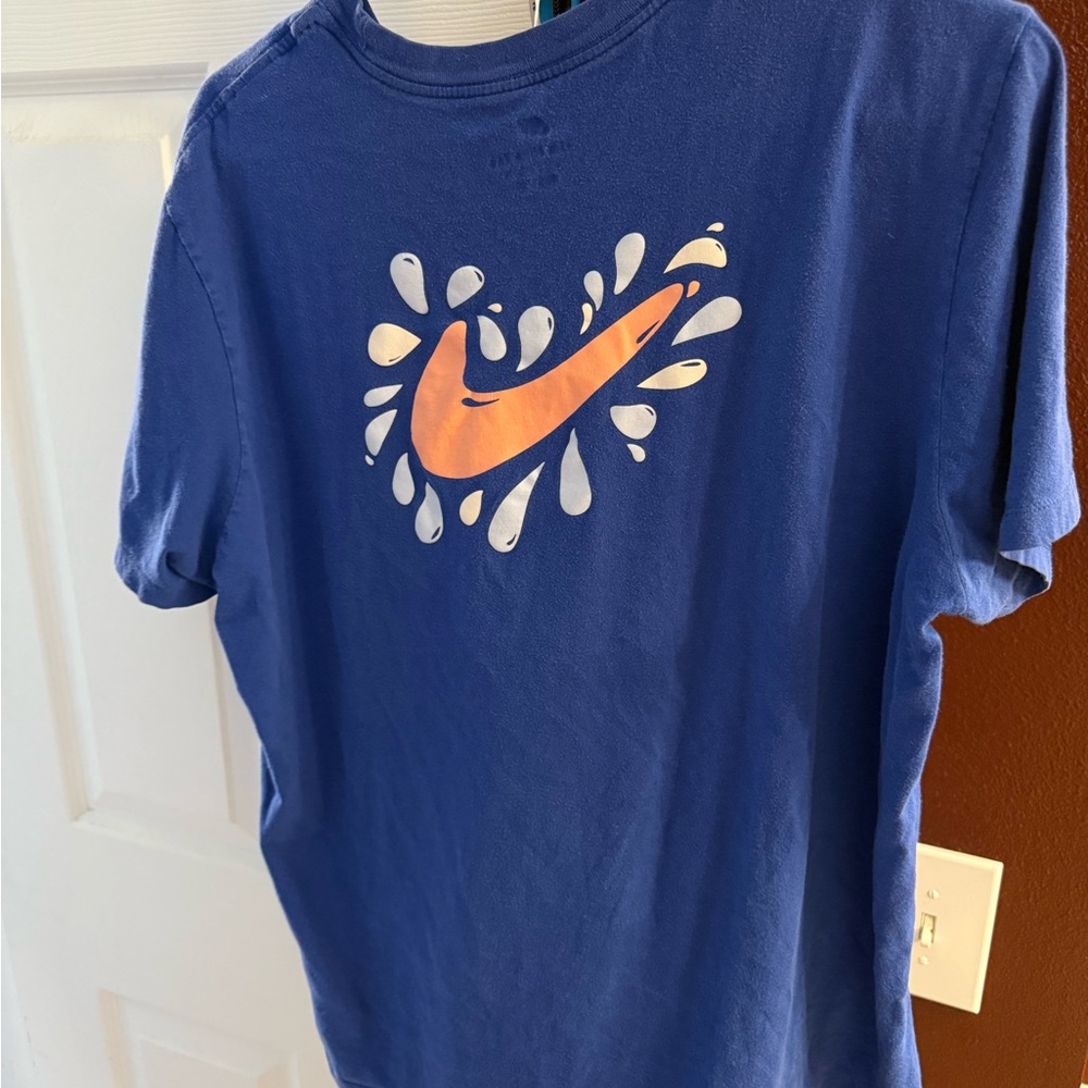 Nike Blue T-Shirt with Orange Logo